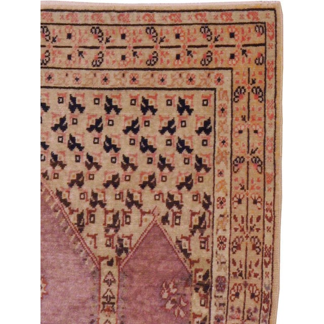 An antique Turkish Sivas throw rug. The triple abrashed blue niche is supported by slim columns and is topped by a deep...