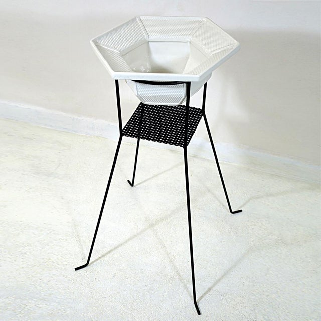 - Very elegant plant stand in the style of Mathieu Mategot and Pilastro in typical fifties style - The stand is made of...