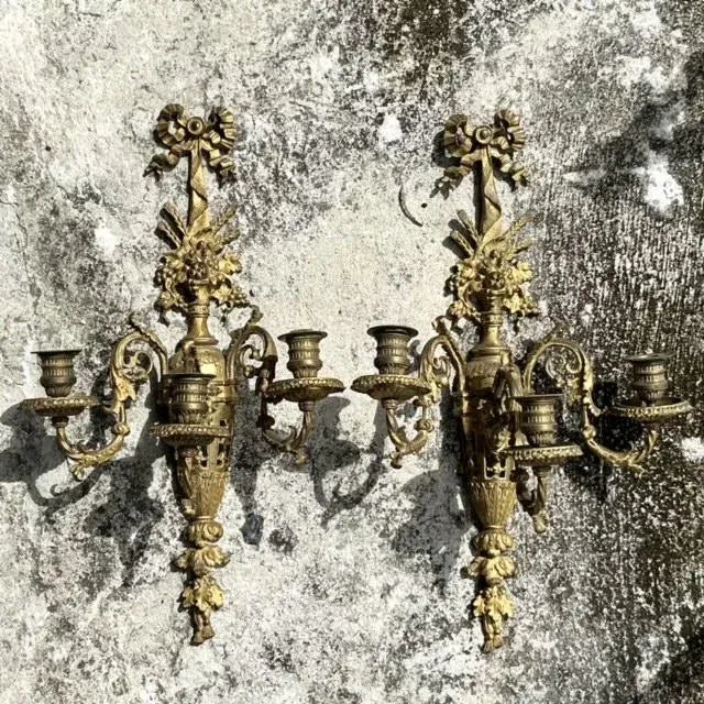 Bring a touch of opulence to your space with this exquisite pair of Vintage Regency Gilt Candle Sconces. Featuring...