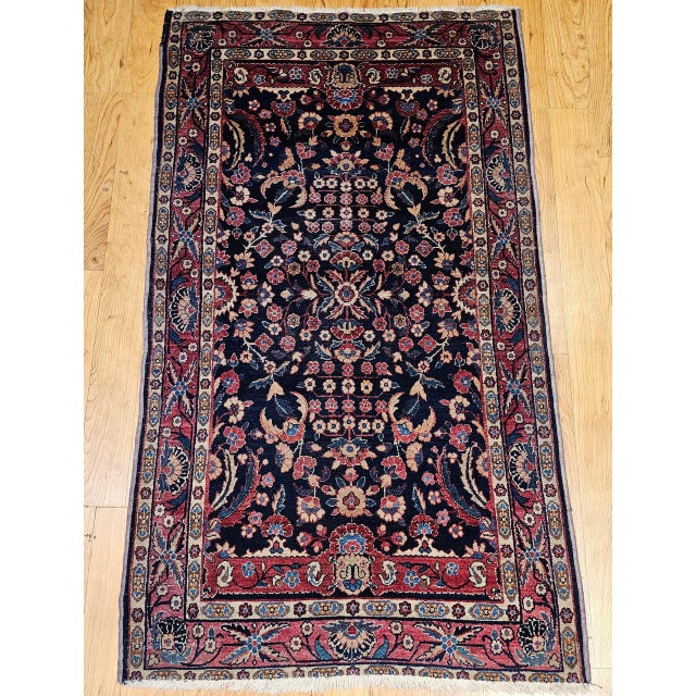 This elegant vintage Indian Agra rug, woven in the early 1900s, features a classic allover floral pattern inspired by the...