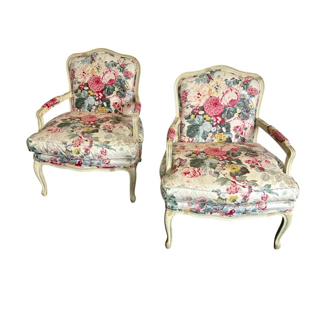 Vintage floral upholstered Louis XVI wooden arm chairs by Century Furniture. The chairs have an antique distressed wood...