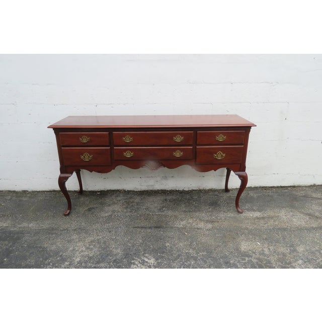 This wonderful Sideboard/Buffet is made out of wood, solid wood, mahogany, oak, and veneer. The sideboard has a Queen Anne...