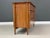 A mid century modern solid maple six drawer dresser which floats between tapered posts. Professionally refinished. 57”...