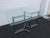 This Dining Table is made out of metal, and glass. The Dining Table has a interesting Hollywood Regency style and design,...