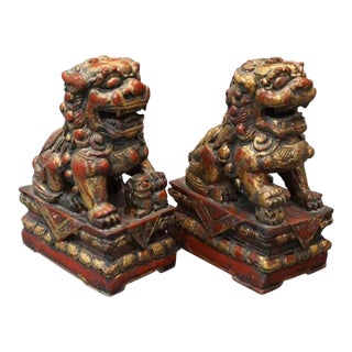 Pair of 19th Century Parcel Gilt and Red Painted Foo Lions Decorative Statues For Sale