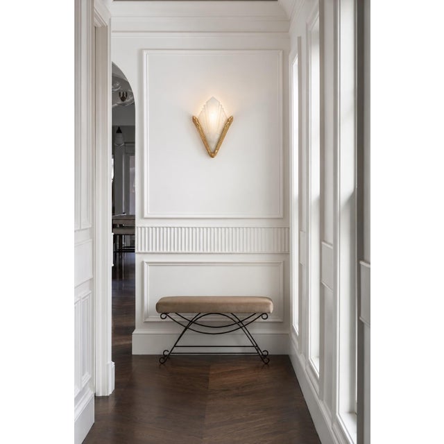 This exceptional pair of French Art Deco wall sconces showcase a modernist design, featuring a striking architectural...