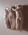 Vintage wall sculpture depicting the Three Graces in high relief composition. Features three intertwined female figures...