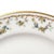 A pair of antique French porcelain bread plates with a floral decoration around the rims. This pair of dishes was made...