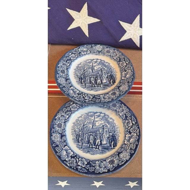 A striking pair of Liberty Blue plates featuring George Washington in a classic colonial scene—perfect for Americana-...