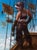 This oil painting presents a dynamic scene of a figure standing on a ship, gazing into the sky where fantastical airships...