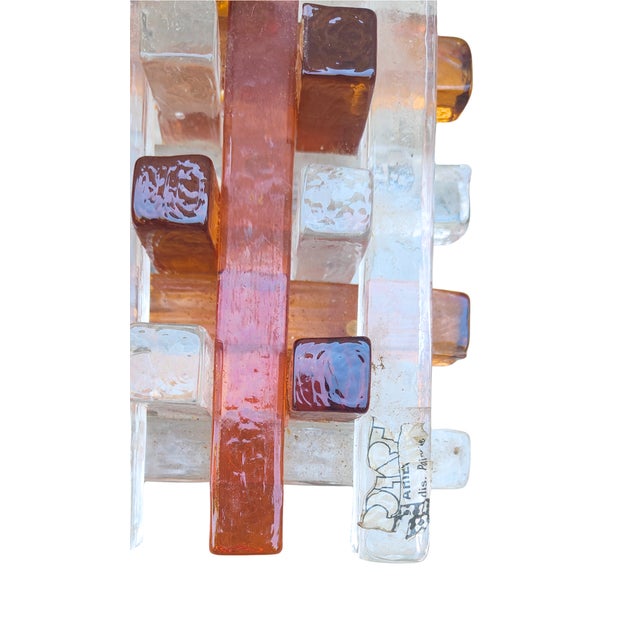 A sculptural presence on the wall. This wall lamp by albano poli for poliarte captures the bold and tactile design...