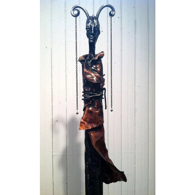 A sculpture "La Rein: The Queen" by Quebecois artist Marie-Josée Roy. It was made by forging stainless steel and folded...