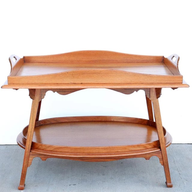 DETAILS An antique bar table or butler's table, serviteur or tray-on-stand crafted of Kingswood, rosewood and mahogany....