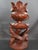 Carved from a single solid piece of wood, a dragon curls its body around to form the base of this sculpture, using its...