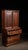 This antique cigar cabinet was made by The Central Cigar Company in the early 20th century. It features three pull drawers...