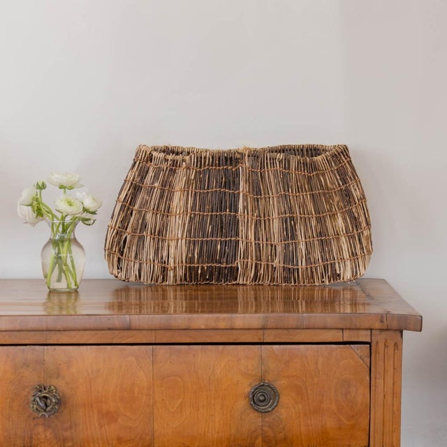 Beautiful shoi kago basket from Japan, early 20th century. Wisteria vine handwoven in a traditional technique. Original...