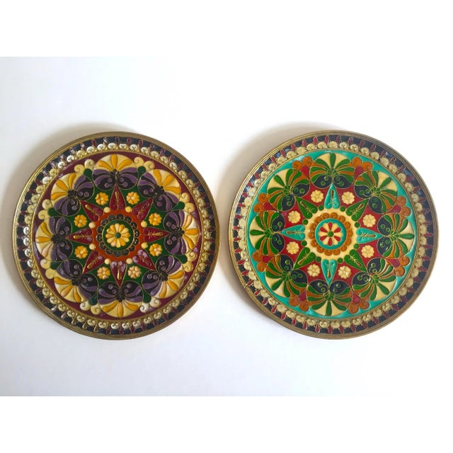 This set of two vintage Mid century Moroccan brass multicolor inlaid enamel decorative wall plates are an incredibly...