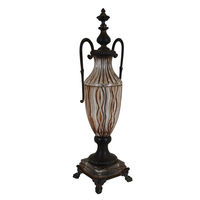 Early 21st century slender, neoclassical mantel urn, fashioned of fluted glass painted with brown accents and dark brass...