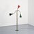 Three-arm adjustable floor lamp produced by O'Luce in Italy around 1950. Made of brass, it rests on a circular, green...