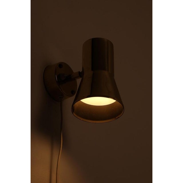 Brass wall lamp model model V-239 designed and produced by Hans-Agne Jakobsson, Markaryd, Sweden, 1960s. This piece is...