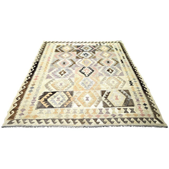 Flatweaved with care using traditional rug-making techniques, this wool rug blends timeless craftsmanship with a modern...