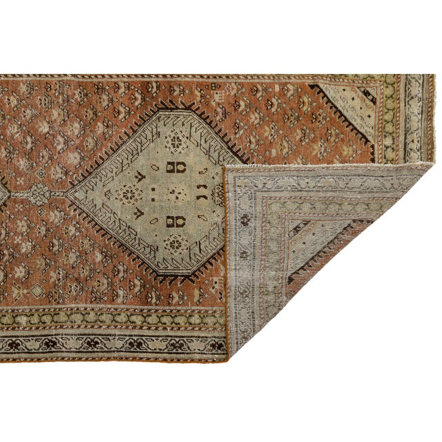 Elevate your hallway or gallery with this exquisite antique Persian Malayer wool runner. Featuring a beautifully...