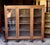 Handsome well made bookcase or display cabinet. From the Stickley era, but there seems to be no markings or labels of a...