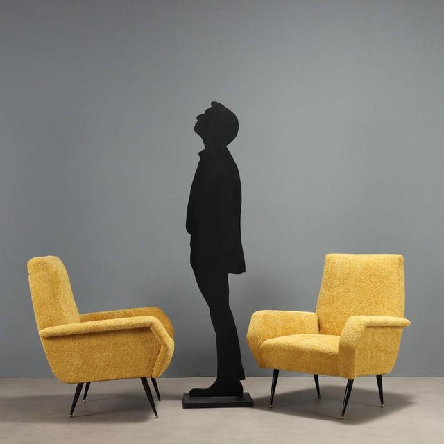 Pair of vintage armchairs recently renovated in terms of padding and yellow fabric upholstery, they feature foam padding...
