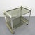 Height: 69 cm. Width: 70 cm. Depth: 43 cm. The serving trolley has some small scratches to the glass commensurate with its...