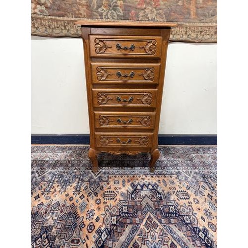 This charming French-style tallboy chest is a beautiful fusion of classic elegance and practical functionality. Crafted...