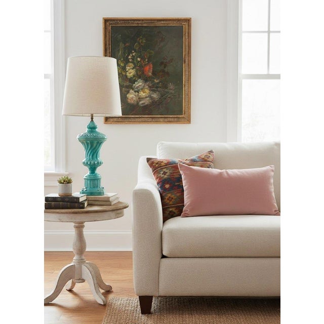 Antique oil on canvas depicting a floral still life with butterflies against a dark background, signed by the French...