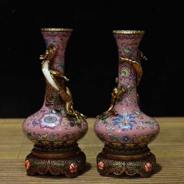 Add a touch of exotic elegance to your space with this captivating pair of vintage Chinese vases. Crafted with a beautiful...
