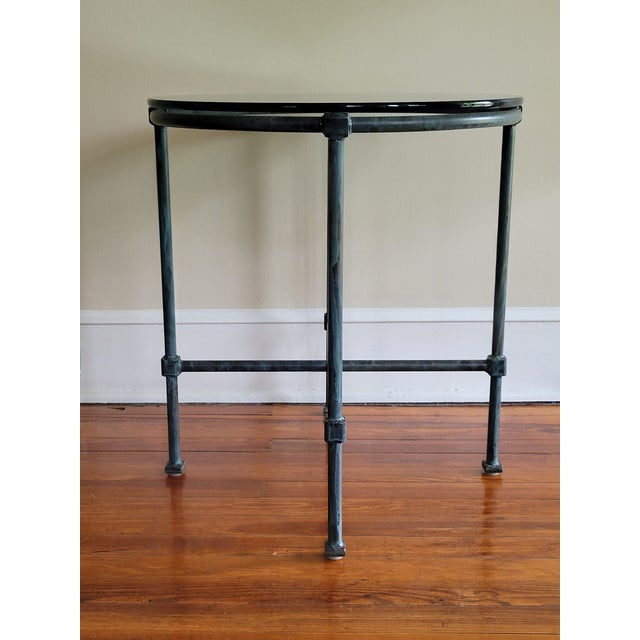 Handsome iron side table boasting a great verdigris patina.