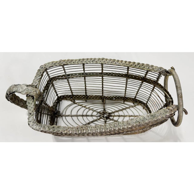 Vintage French braided silver plate wire wine bottle holder or caddy. Very well made with woven braids of silver to the...
