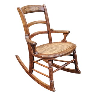 Early 20th Century Victorian Walnut and Cane Seat Rocker For Sale