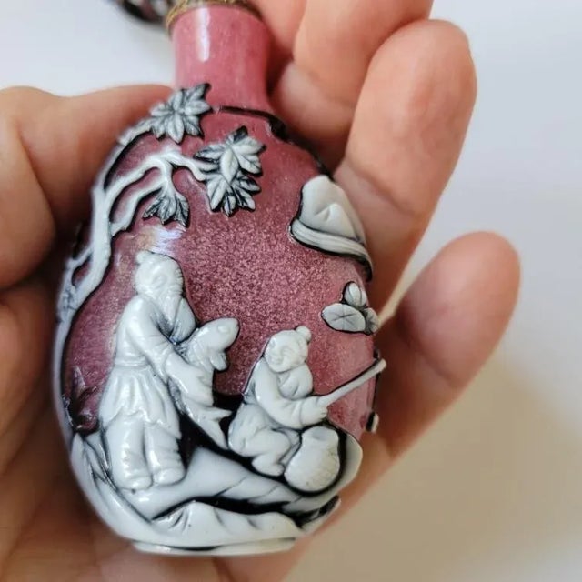 For the Collector: Wonderful Late Qing, Early Republic era Peking glass pink snowstorm snuff bottle with a layer of black,...