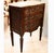 A small Italianate version of a leggy carved chest of drawers, with a faux marble painted top and a charmingly carved...