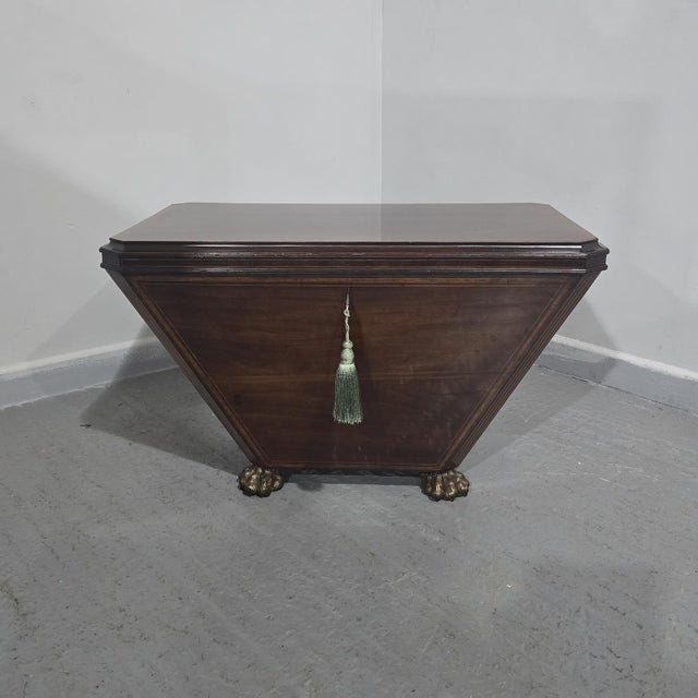A very good quality sarcophagus shaped inlaid mahogany wine cooler by Edwards and Roberts, gilt bronze lion paw feet and...