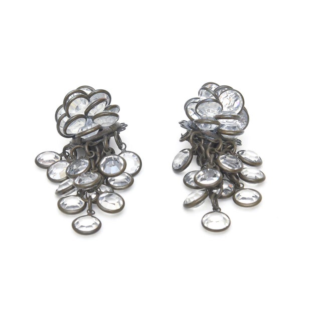 These vintage 1980's Sorrelli clip on dangle cluster earrings are Swarovski crystal glass with a blackened bras base metal...