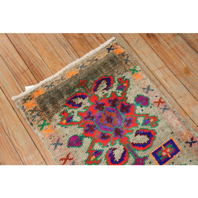 Quirky vintage Turkish Anatolian floral rug featuring vibrant colors on a silver field Measures: 1'5' x 2'10".