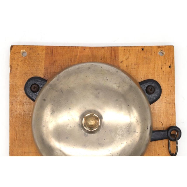 Antique cast brass boxing bell mounted on wood with a chain pull actuator and cast iron mechanism. Boxing bells were...