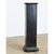 A tall vintage wooden pedestal, painted with a worn black paint finish, is perfect for displaying plants or decorative...