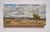 The painting captures a vast landscape under a dynamic sky, where billowing clouds create a sense of movement and depth. A...