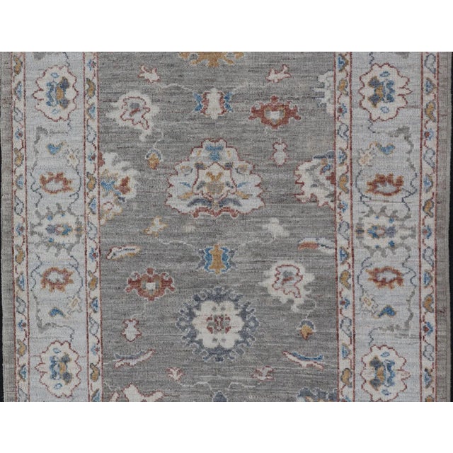 Blue Floral Designed Oushak With Muted Background With Earthy Tones and Soft Blue For Sale - Image 8 of 13