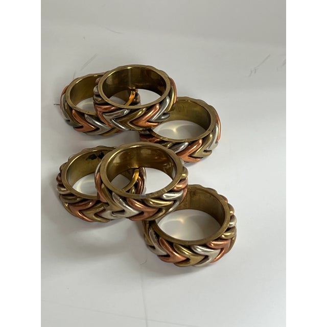 A set of 12 vintage napkin rings! They would look so great on your table especially at the holidays. Made from Brass,...