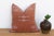 Bold X-shaped crosses mark each corner of this handcrafted Moroccan cactus silk pillow, framing a central ladder-like...
