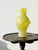 Elegant Murano glass vase with a scavo finish in a beautiful dark yellow hue. Its slender baluster silhouette is adorned...