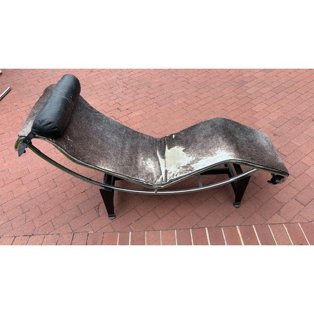 Vintage Modernist Chrome Chaise Lounge attributed to Le Corbusier LC4 with Cowhide Upholstery An iconic Modernist chaise...