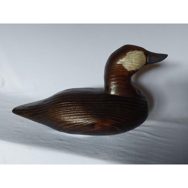 A vintage hand carved wood Duck Decoy, country decorative accessory. The Decoy is made from a heavy wood and has the...