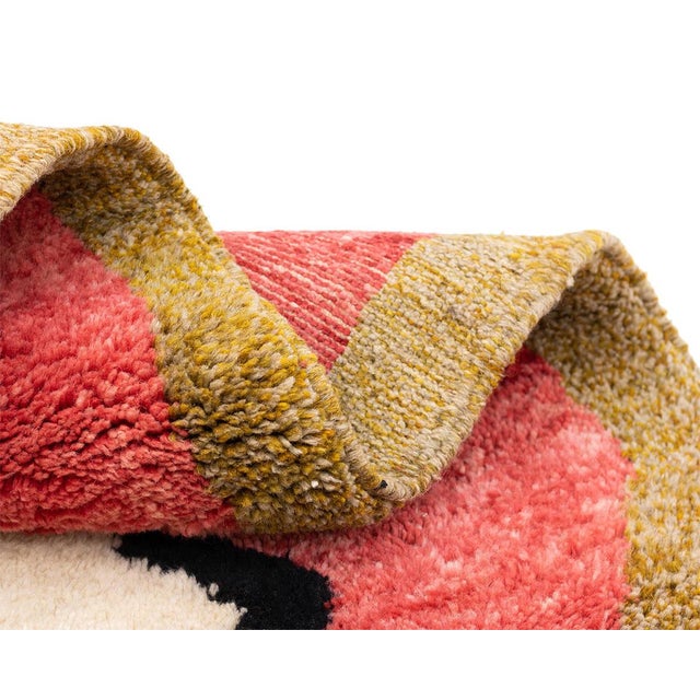 Dynamic hand-knotted wool rug with vibrant zigzag patterns in Midnight Black, Crimson Red, Sage Green, Fire Green, Taupe,...